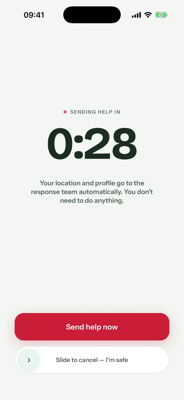 The app’s countdown: Sending help in 0:28, a Send help now button and the slider Slide to cancel, I’m safe